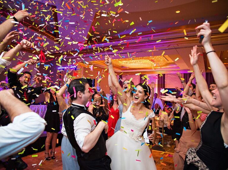 Couple celebrating on the dance floor with confetti