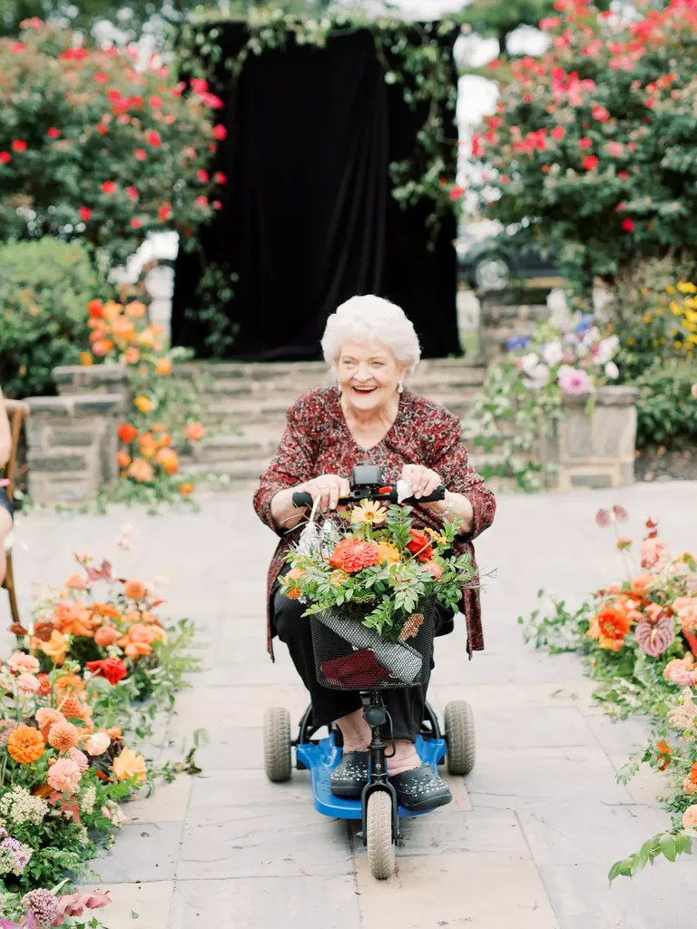 Grandma Processing into Ceremony on Electric Scooter