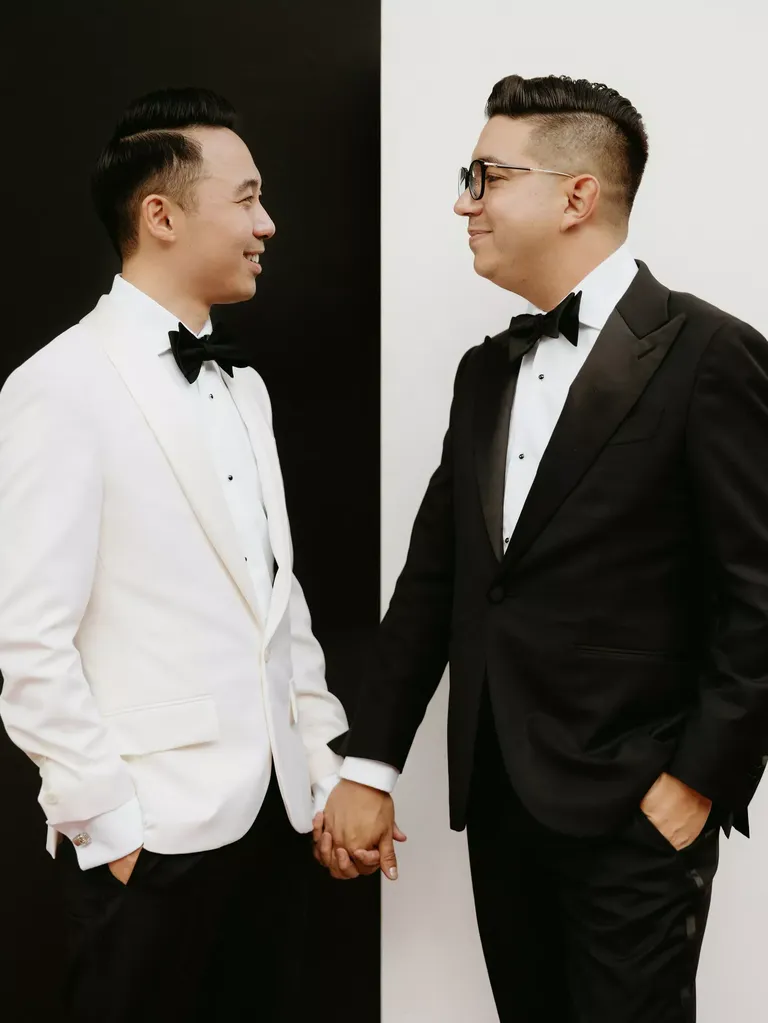 Offset Black-and-White Tuxedos With Classic Background for Two Grooms