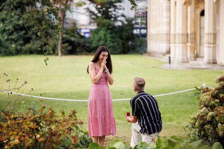 Proposing in the gardens of the Royal Pavilion, Brighton, England. 