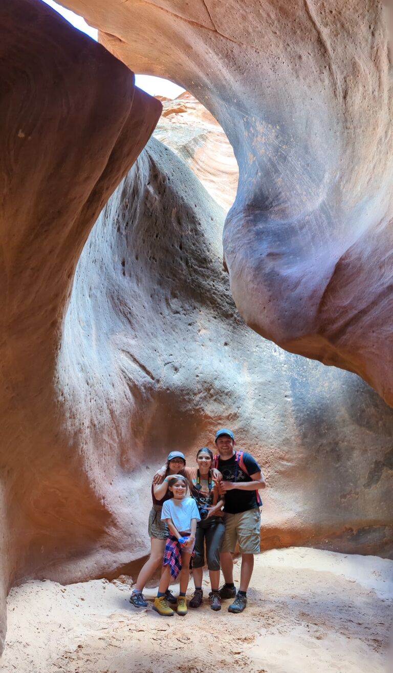 Cute little family continues vacation in Zion National Park where they hiked through a slot canyon