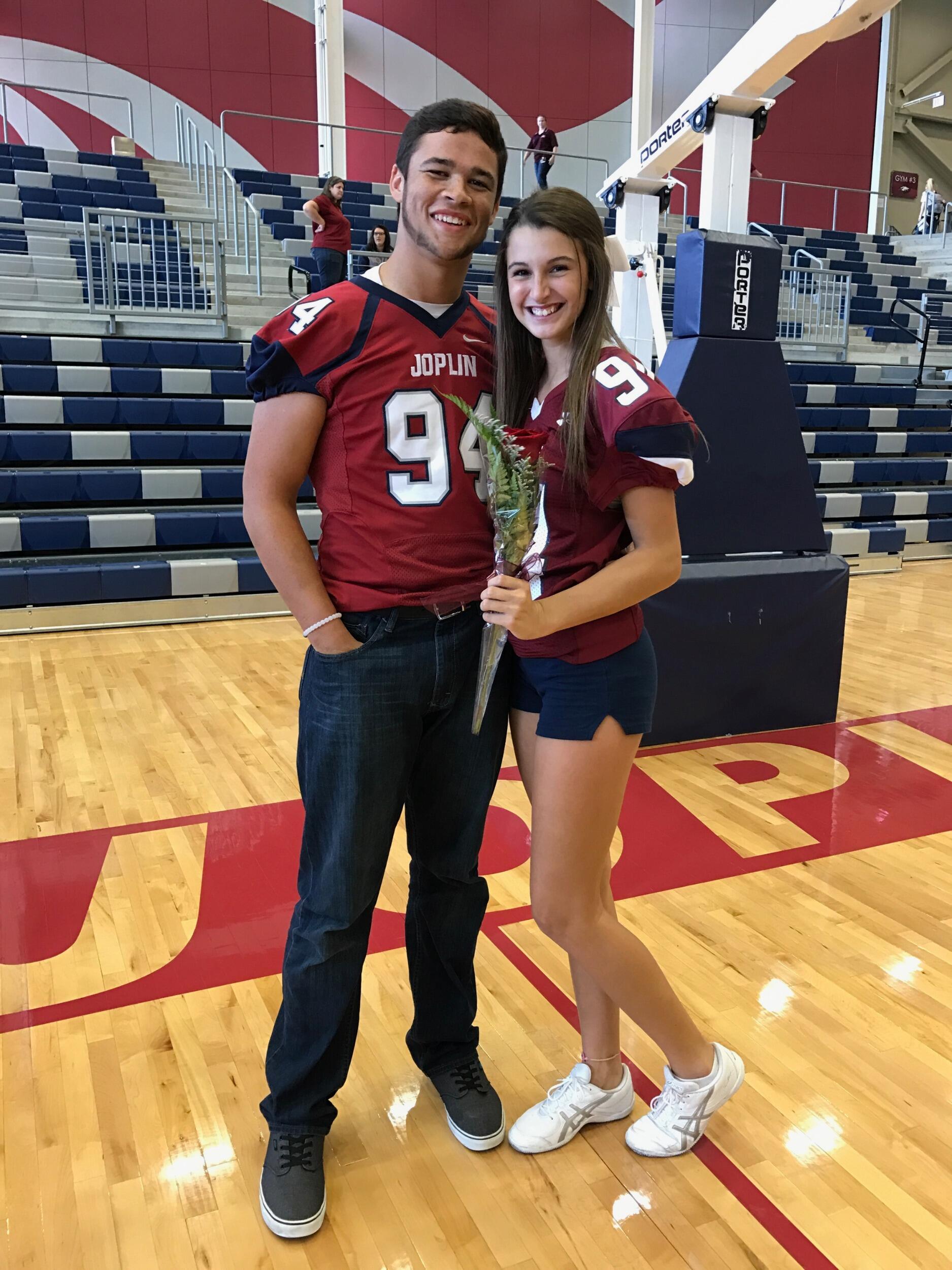 Nate played Varsity football & I was a cheerleader! During homecoming, I asked Nate to be my "escort" for homecoming queen at the pep rally!