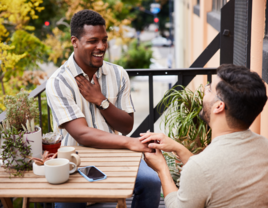 Man proposing to boyfriend on terrace