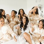 bridal party dancing in champagne bridesmaid robes