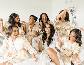 bridal party dancing in champagne bridesmaid robes