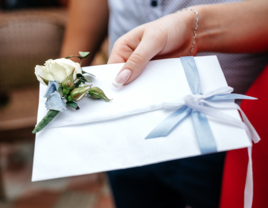 woman carrying wedding card