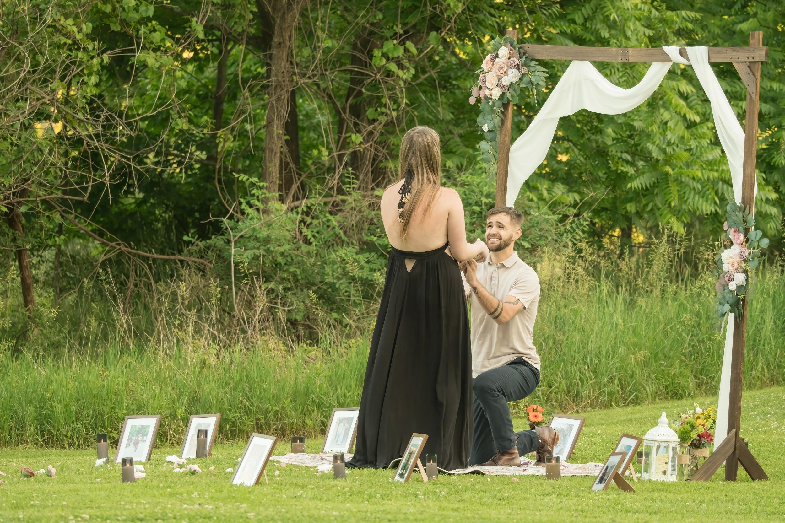 On a beautiful day in June, CJ and Kendra were celebrating their three year anniversary (of their second relationship) a day early. CJ didn't eat much at dinner and looked like he was going to be sick on the way home to a family party, and even had to stop for gum on the ride there so he wouldn't throw up. As they walked in to Kendra's Uncle Lance and Aunt Paola's house, they were greeted by Kendra's Aunt Paola, Grammy, and older sister Taylar. The three sent CJ down to the pond and distracted Kendra while he set up the perfect proposal. They then walked her down to the pond where she stumbled upon her future husband waiting for her to say yes to spending the rest of her life with him. 