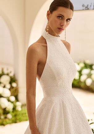 Jazmin brocade wedding dress with halter neckline, open back, A-line silhouette, smooth finish and skirt with pockets