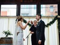Couple taking wedding ceremony tequila shots