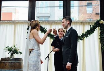 Couple taking wedding ceremony tequila shots