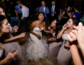 Bride and bridesmaids singing at wedding with music by Premier Wedding DJs in Pittsburgh