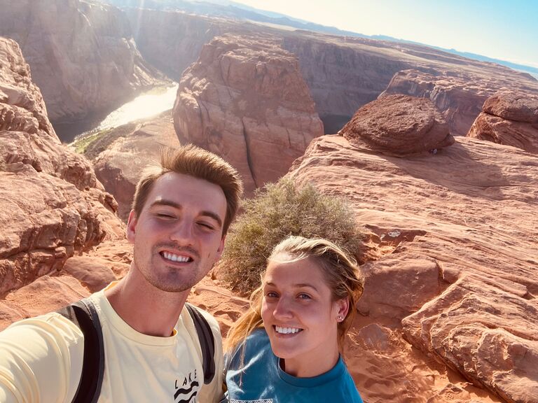 Visiting Horesshoe Bend. Emily changed out of her dress she was in for Antelope Canyon because she thought Trevor would propose there. So she got in a comfy T-shirt, athletic shorts, and high white socks.