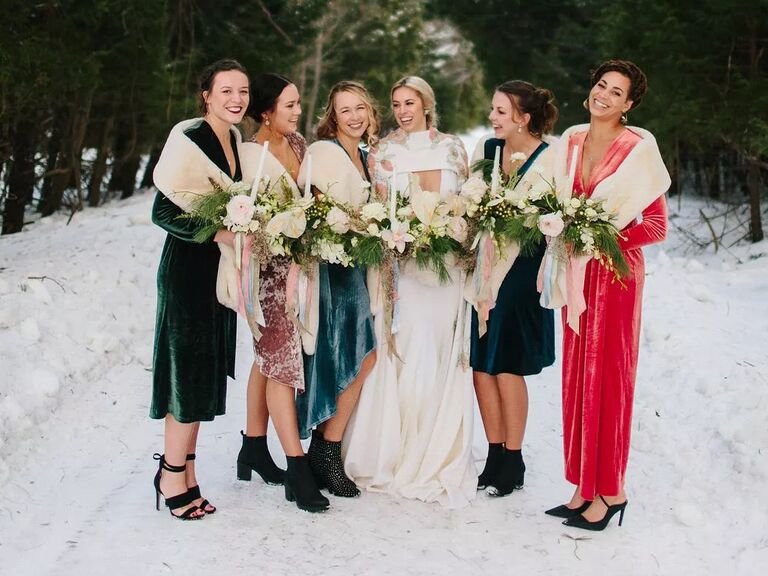 real wedding photo of winter wedding bridesmaid dresses with a snowy backdrop