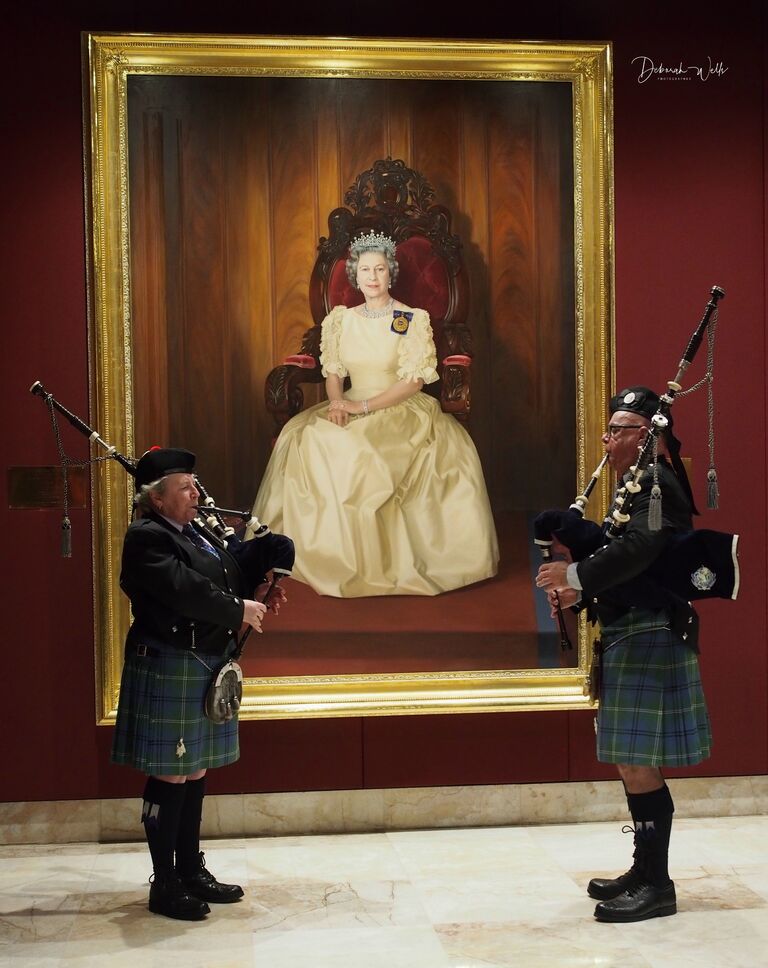 Playing pipes for HRH Queen Elizabeth II's 70th Jubilee in front of the portrait of her sitting for her 40th Jubilee at NSW Parliament House.  This was a world wide event with pipers all over the world playing the tune "Diu Rengare" at the same time.