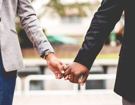 Couple holding hands