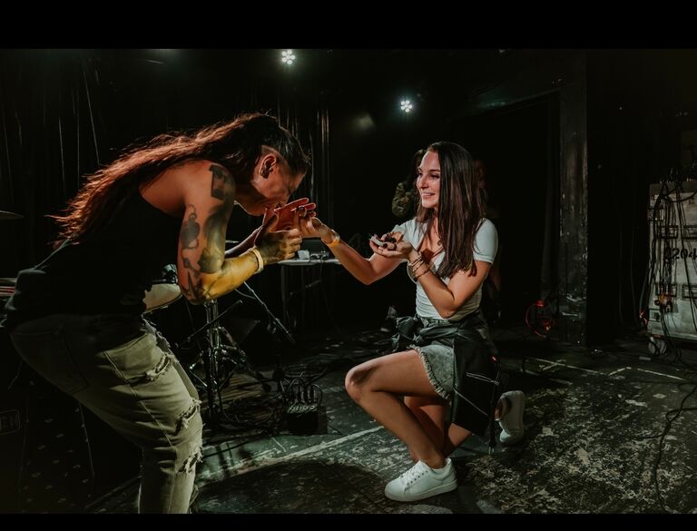 Surprise engagement on stage at the concert of Hailey's favorite artist