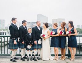 groomsmen in kilts for Irish wedding posing with wedding party