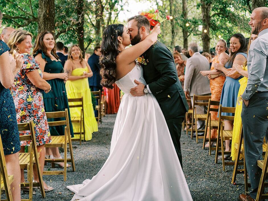 Couple kissing at adults-only wedding ceremony