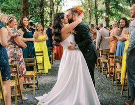 Couple kissing at adults-only wedding ceremony