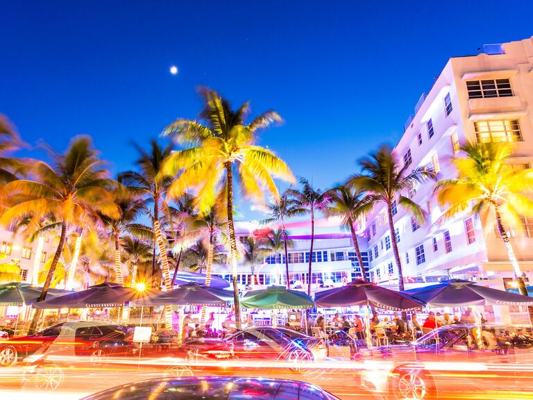 Cars speed down Ocean Drive