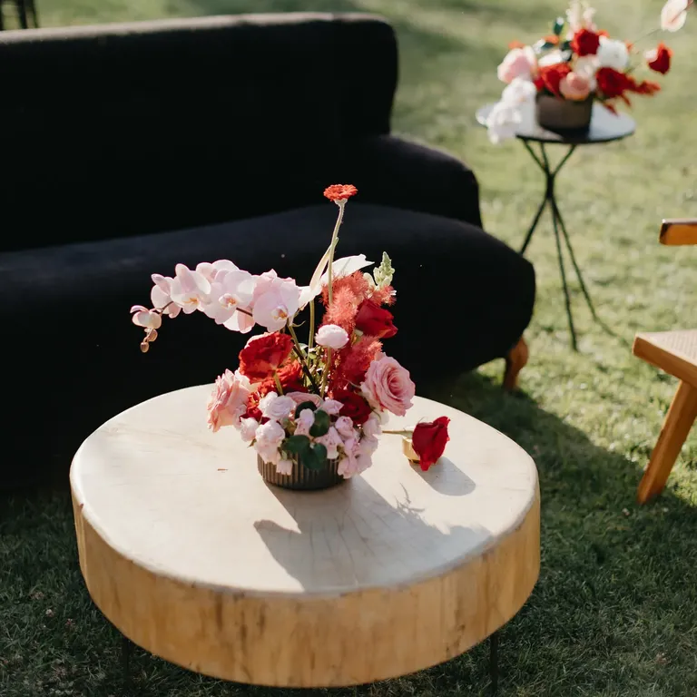 Rehearsal dinner lounge area with floral and wood decor inspiration