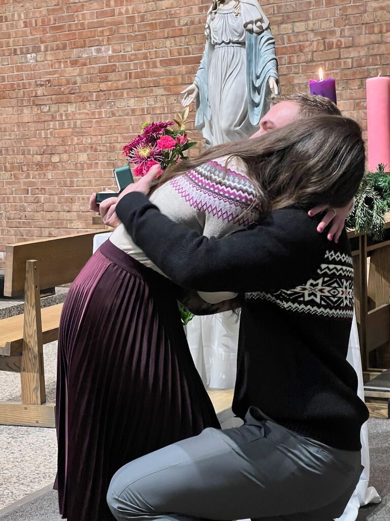 Matthew proposing to Emily after Mass on Emily's birthday! Can you tell Emily is crying?