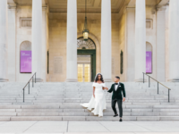 Bride and groom walking down steps of Baltimore Museum of Art wedding venue