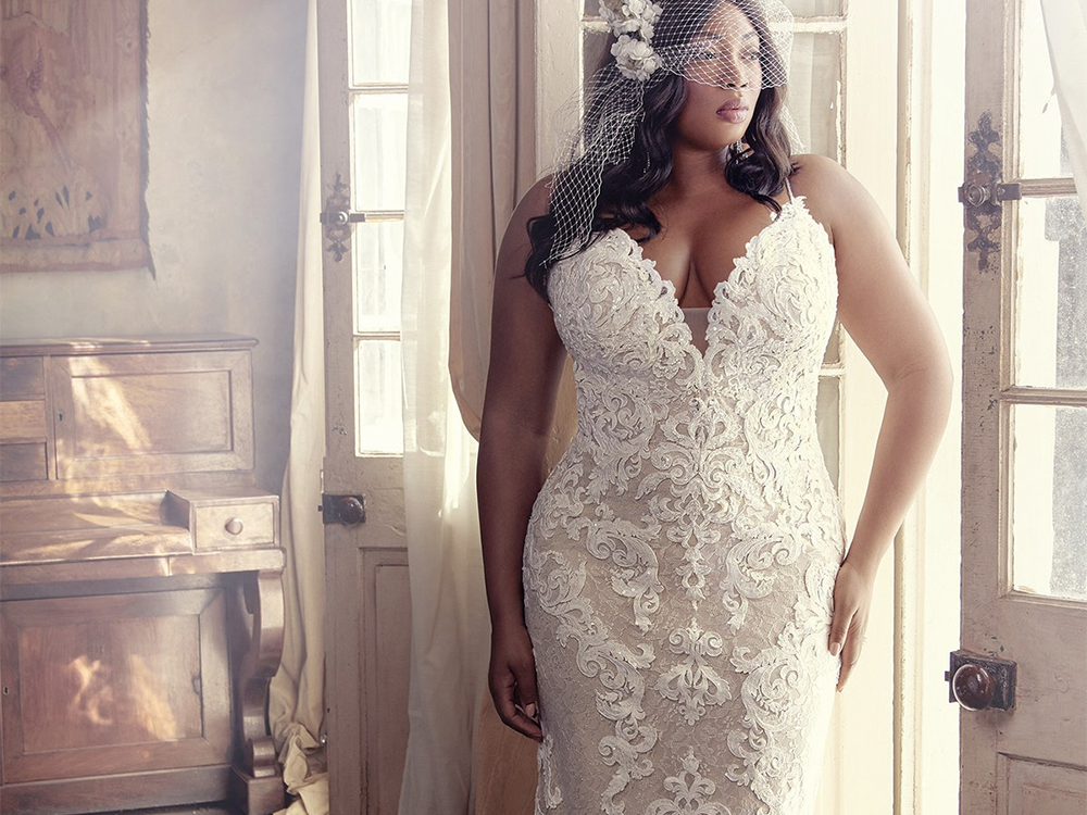 Plunging sleeveless dress with lace details and fit and flare skirt