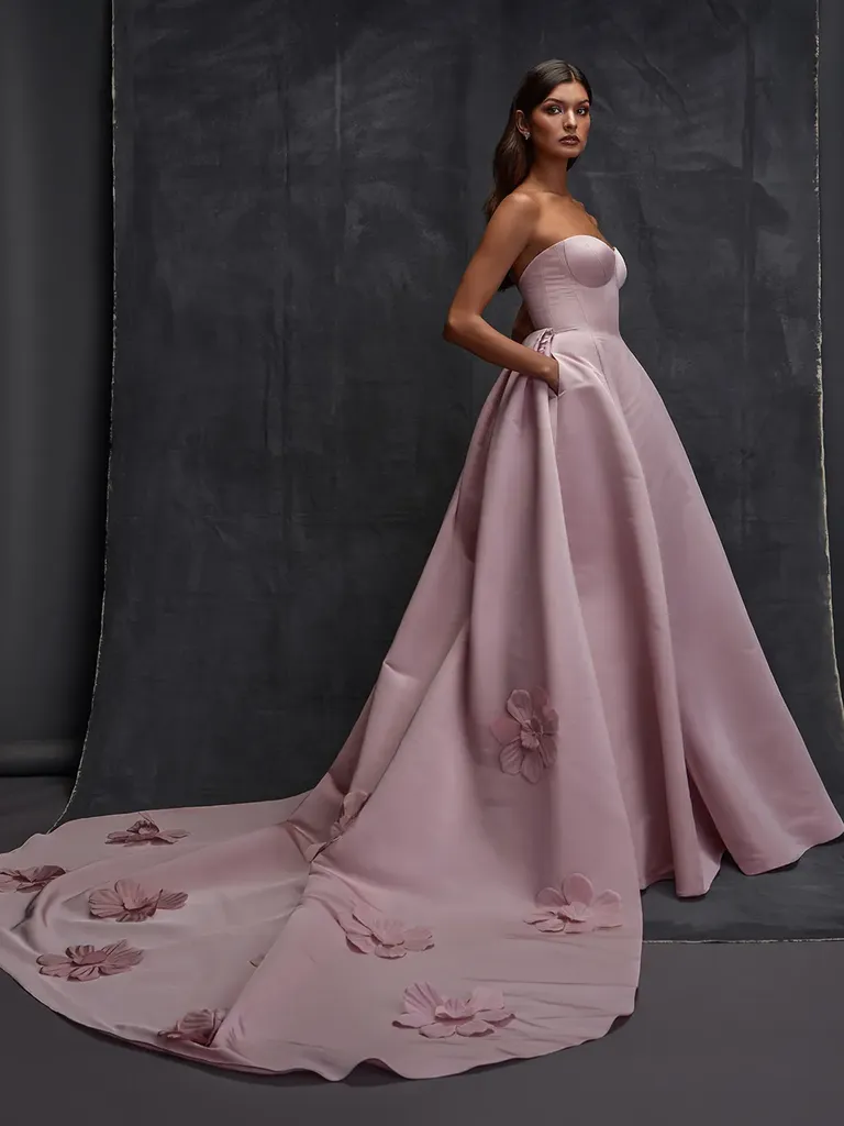 Strapless pastel pink wedding dress with floral train detail