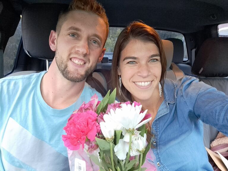 Andrew picking Alysa up on her return from a week in Maine with Perkiomen Tours... with flowers soo cute.