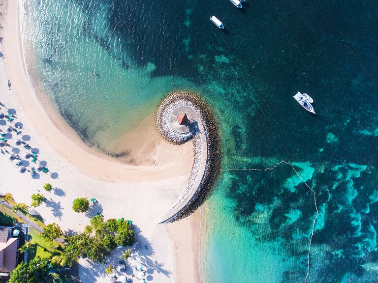 Bali coast with a figurative breakwater aerial view