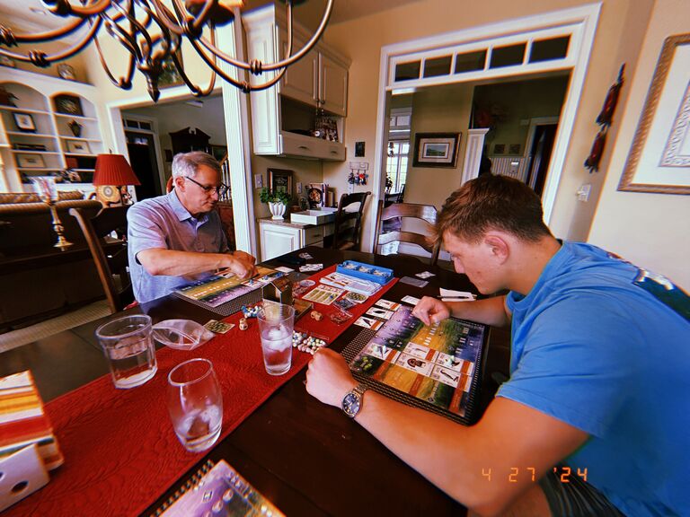 Katie knew Mark was a keeper when he showed his eagerness to learn her dad's favorite game Wingspan (aka "Birds"), a veryyy tedious game.