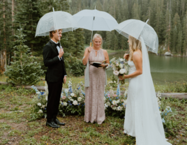 Couple married by officiant in the rain