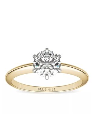 round solitaire diamond engagement ring with simple gold band