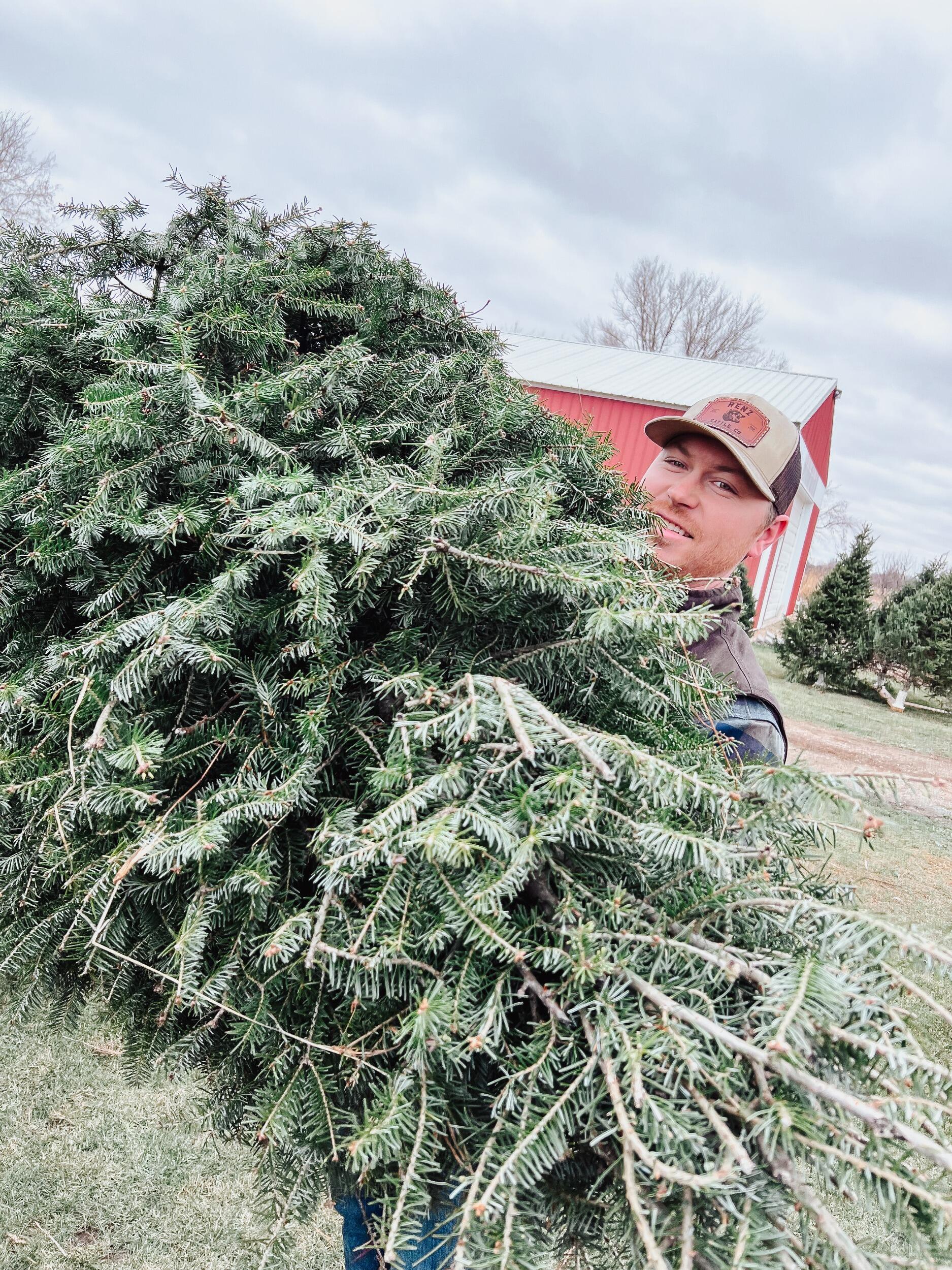 In addition to lots of family time, Austin and Lorica's first Christmas in their first home together called for a new tradition - cutting down their Christmas tree!