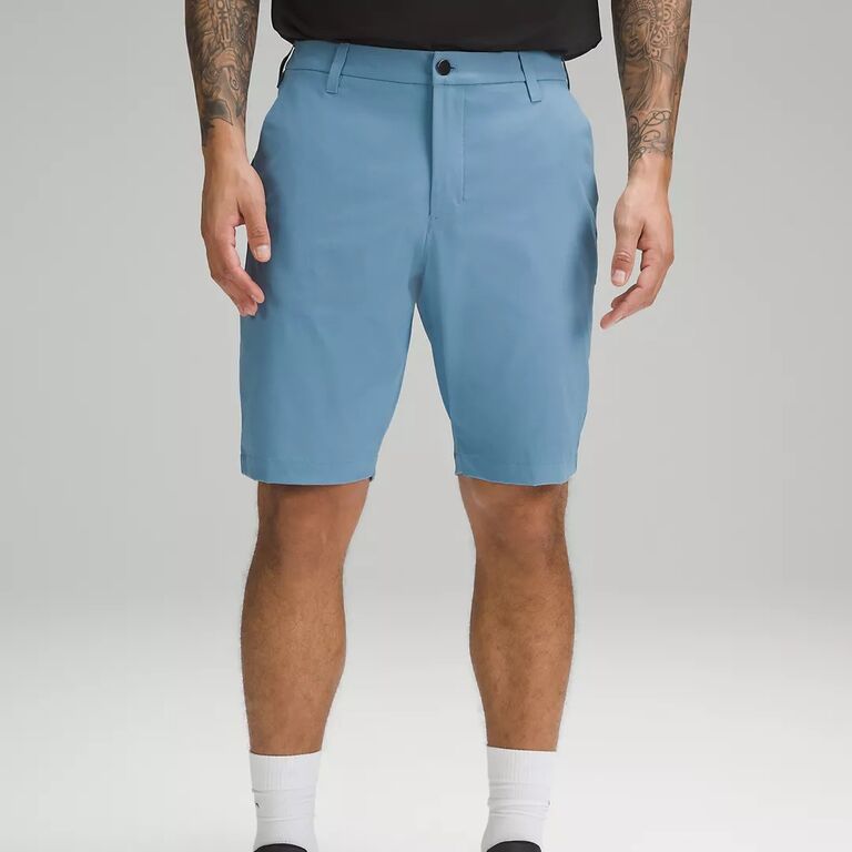 A pair of light blue golf shorts that reach the knee from Lululemon