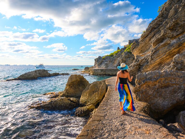 Woman walking on a coastal pathway