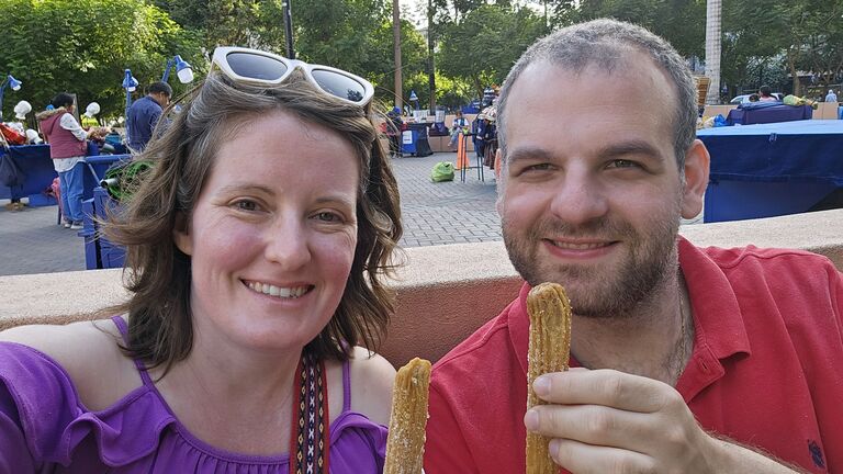 Trying churros in Lima, Peru.