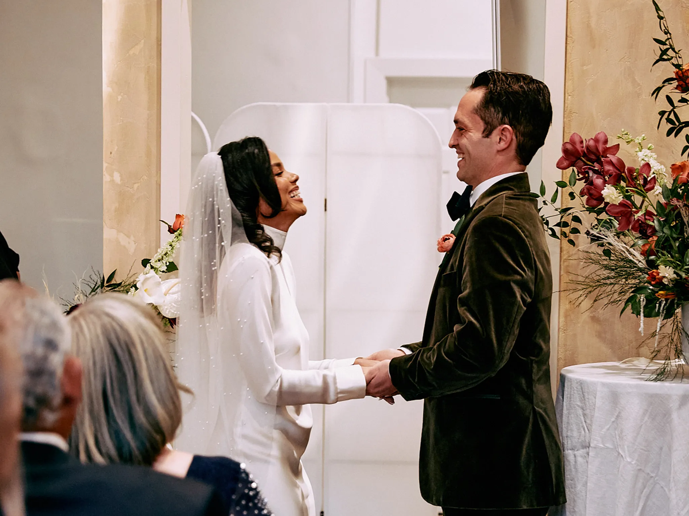 Couple exchanging vows during wedding ceremony.