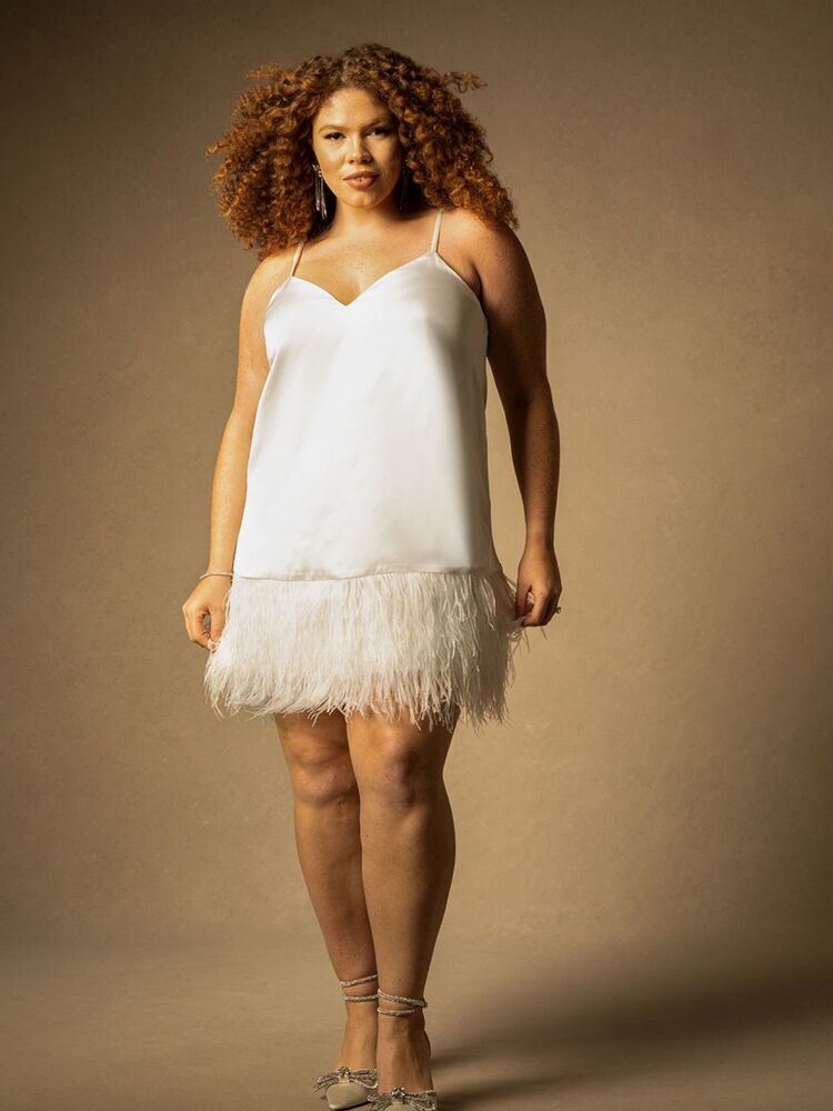 White bachelorette slip dress with feather hem from ELOQUII