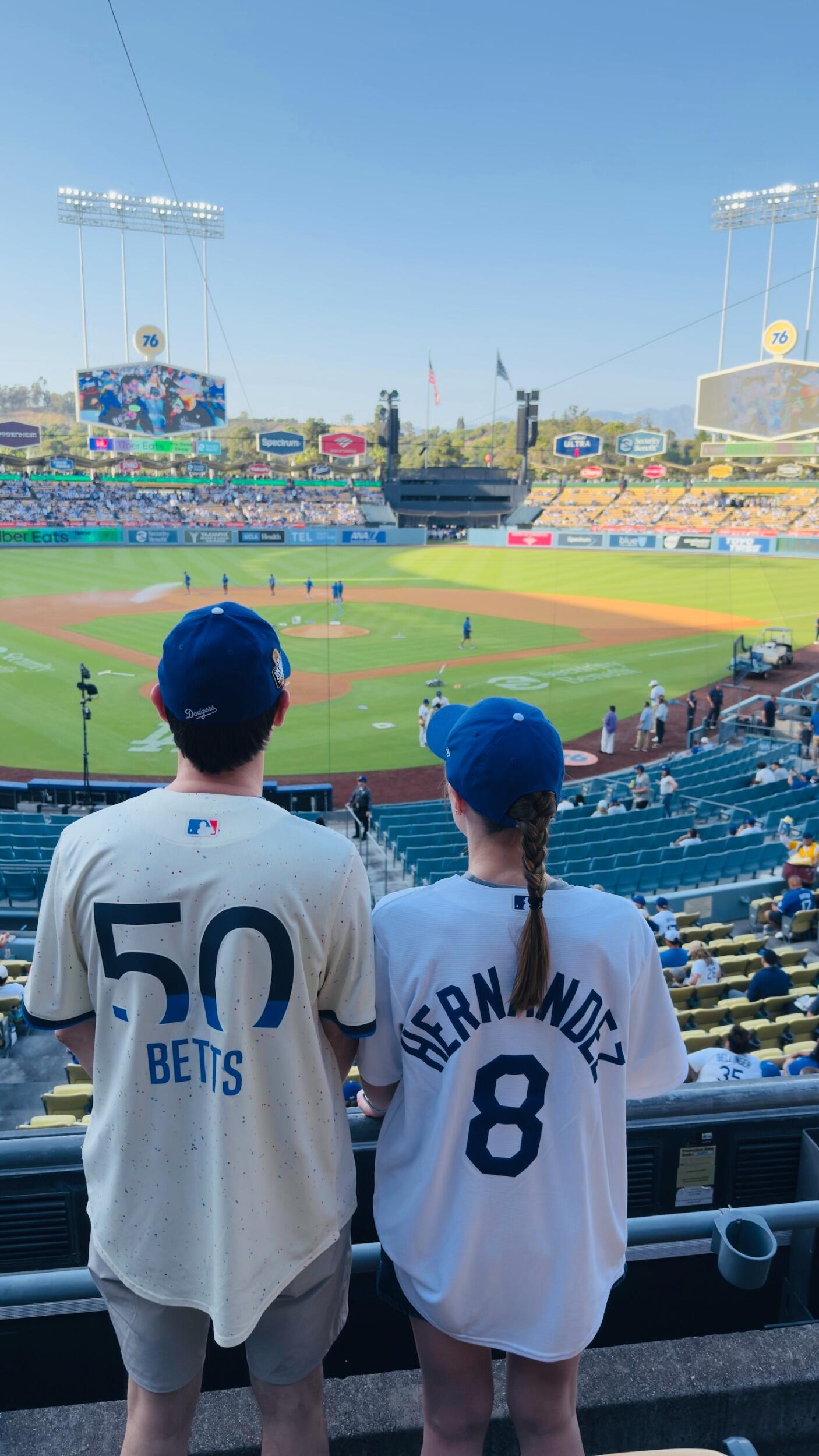 Kirsten attends her first Dodgers game at Dodger Stadium with Tyler and their dads! What a difference a year makes-- now Kirsten owns a jersey, not just a hat!