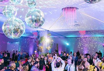 Disco ball ceiling at a rave wedding