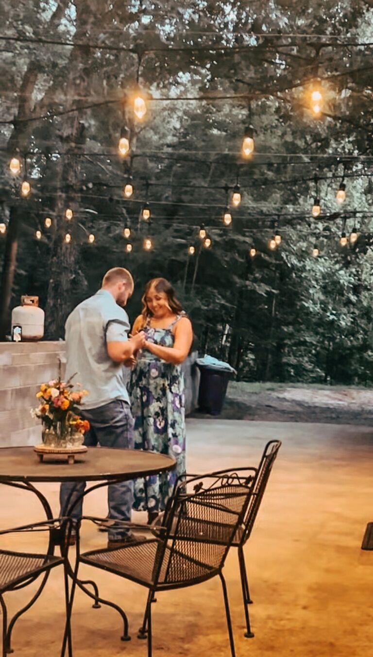 He told me he was putting up these lights but I had no idea he was going to propose to me under them at the end of the week