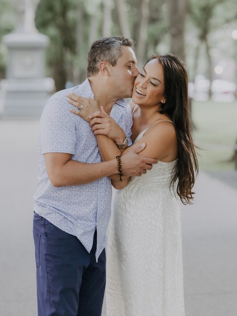 Couple pose for their summer engagement photo shoot. 