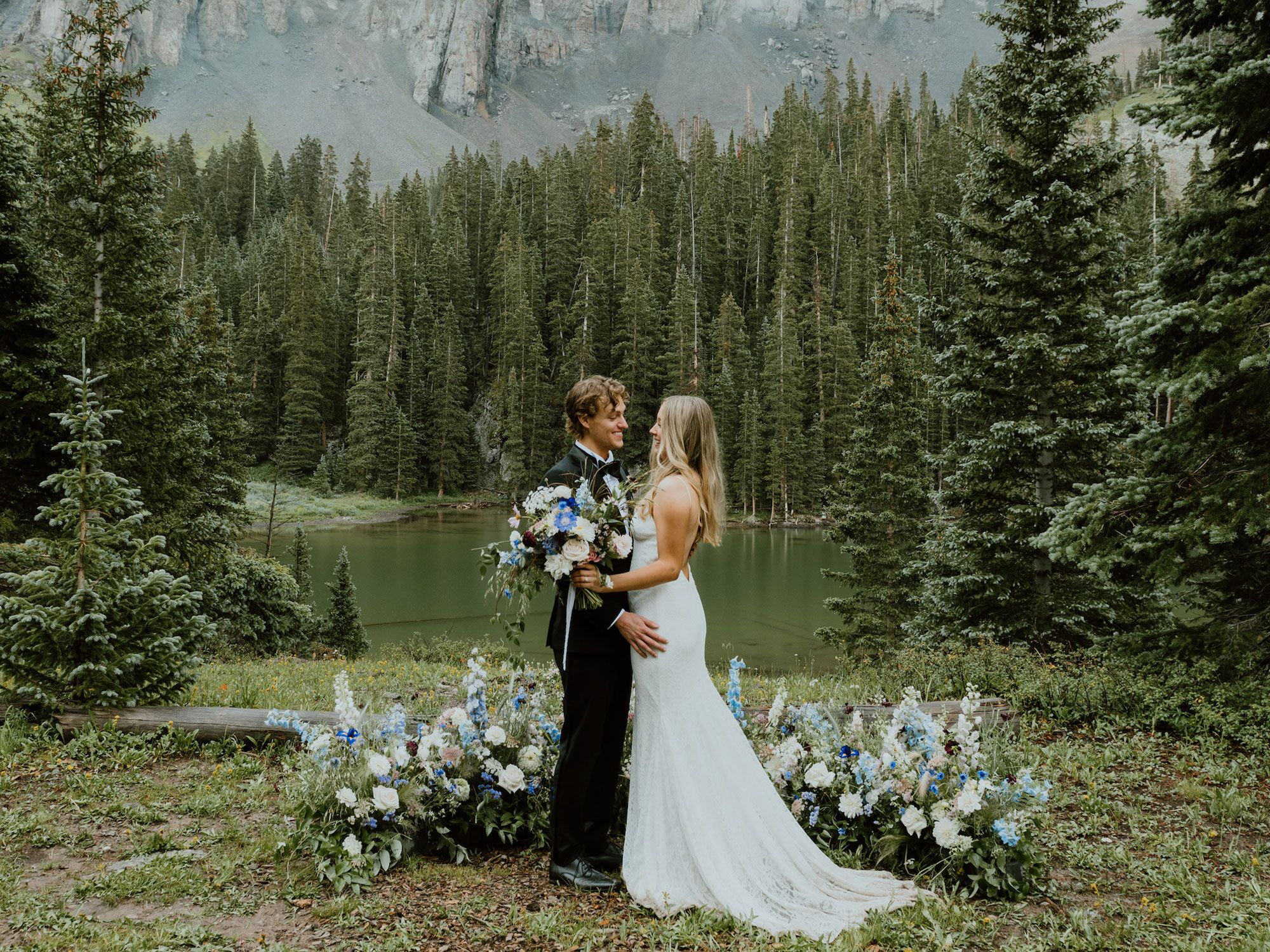 Couple standing in the middle of a woodland forest wedding venue