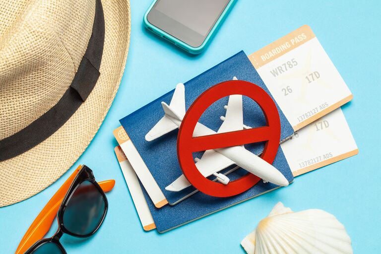 airplane crossed out due to cancellation graphic with passport and model airplane cute hat