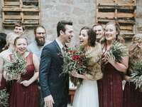 wedding couple with wedding party in snow