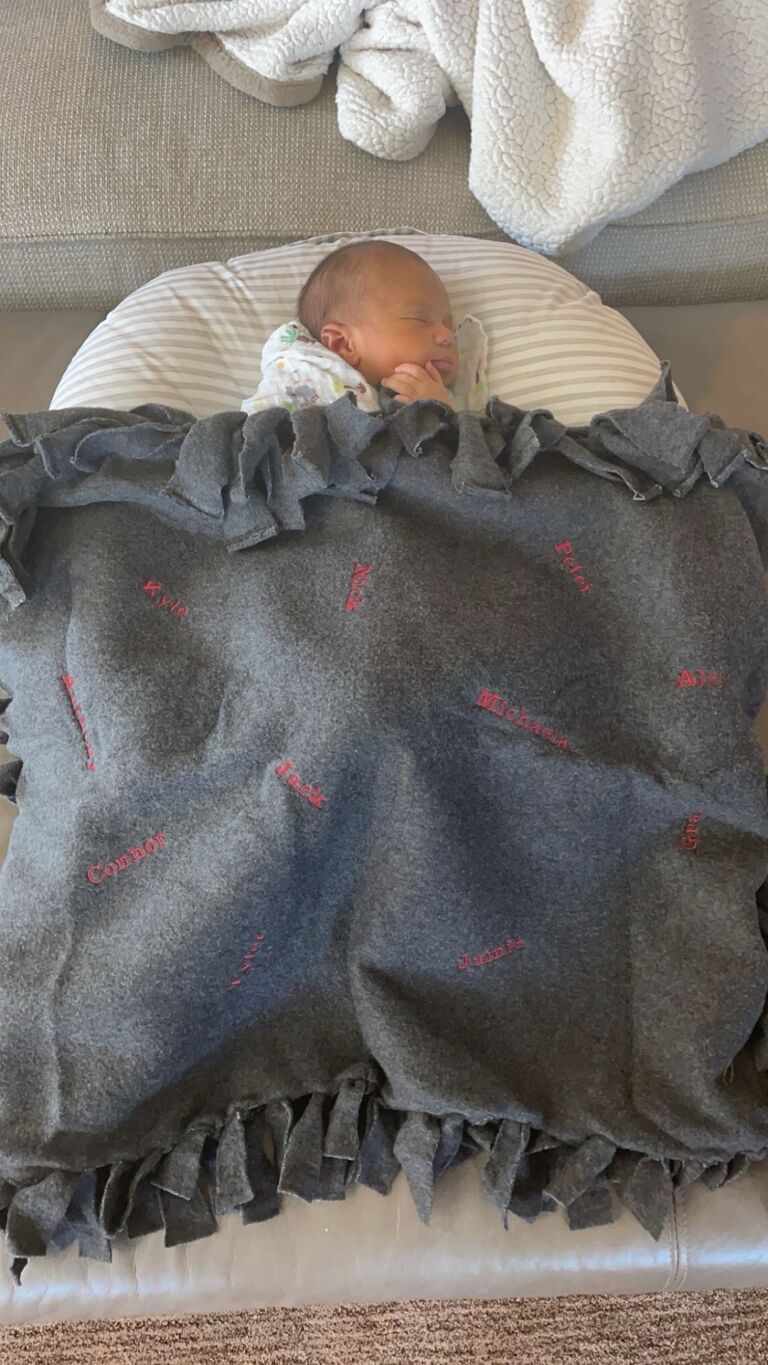 Nick coordinated getting Meaghan's son, Navi, a blanket from all of their college friends for her baby shower. It's a blanket we still keep in Navi's room to this day!