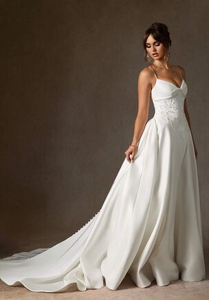 Turn heads on your special day by wearing the Emberlyn dress. This stunning double-faced satin style combines a V-neckline with a twist detail, a hand-placed beading at the bodice, self-cover back buttons, and a voluminous A-line skirt with a chapel-length train.