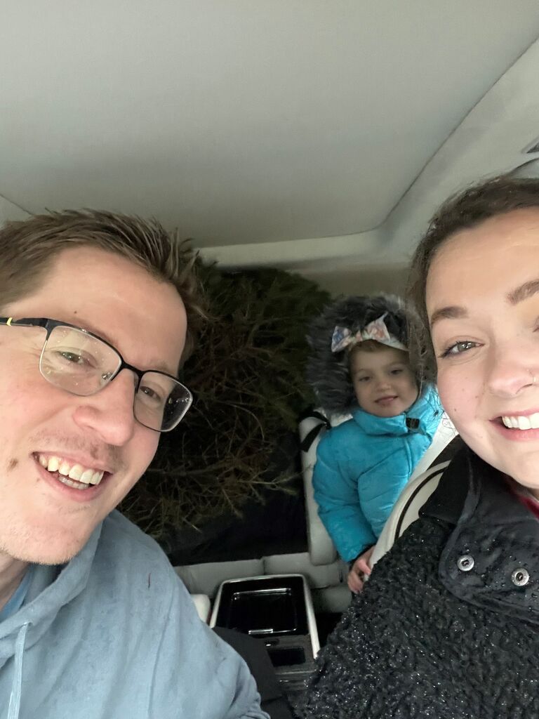 Steve & Sarah take Zoey to pick out the Christmas tree. Steve chopped down Zoey's choice and they put it in the back of the SUV. This was Sarah's first time cutting down the tree. 